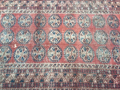 Lot 1426 - Eastern rug with 27 central medallions on red and blue ground, 200cm x 128cm