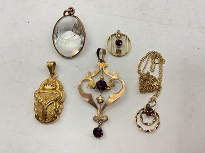 Lot 1129 - Edwardian 9ct gold open work pendant, gold pendant on 9ct gold chain, two other yellow metal pendants and a crystal pendant