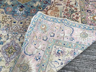 Lot 1432 - Large rug with central medallion and animal decoration on beige, blue and pink ground, 363cm x 272cm