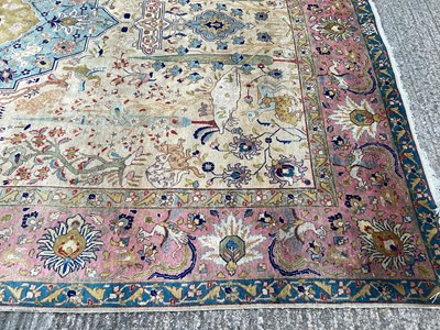 Lot 1432 - Large rug with central medallion and animal decoration on beige, blue and pink ground, 363cm x 272cm