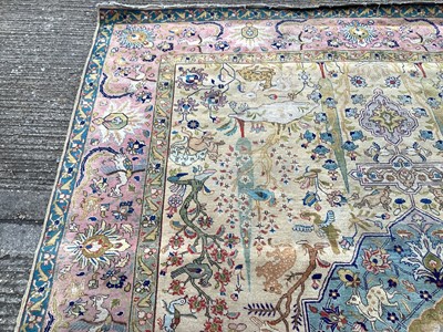 Lot 1432 - Large rug with central medallion and animal decoration on beige, blue and pink ground, 363cm x 272cm