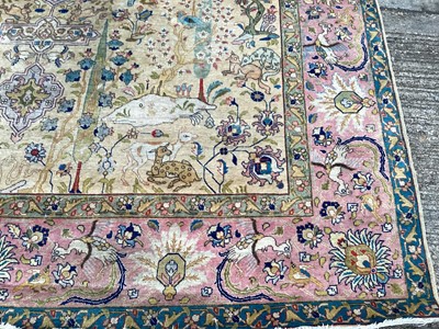 Lot 1432 - Large rug with central medallion and animal decoration on beige, blue and pink ground, 363cm x 272cm