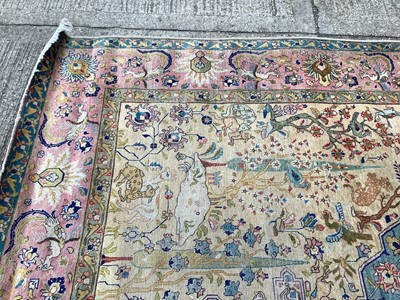 Lot 1432 - Large rug with central medallion and animal decoration on beige, blue and pink ground, 363cm x 272cm