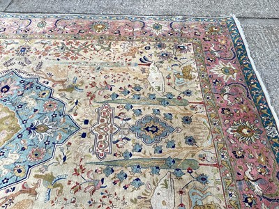 Lot 1432 - Large rug with central medallion and animal decoration on beige, blue and pink ground, 363cm x 272cm