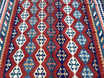 Lot 1438 - Kilim rug decorated with rows of medallions on multicoloured ground, 238cm x 176cm