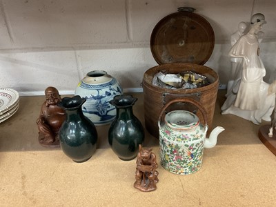 Lot 80 - Antique Chinese blue and white jar, a Canton teapot in wicker case, two Chinese carved wooden figures, and a pair of monochrome green vases