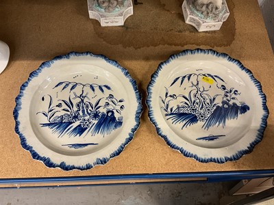 Lot 83 - Pair of early 19th century pearlware plates, probably Liverpool, painted in blue in the Chinese style, shaped edges, 24cm diameter