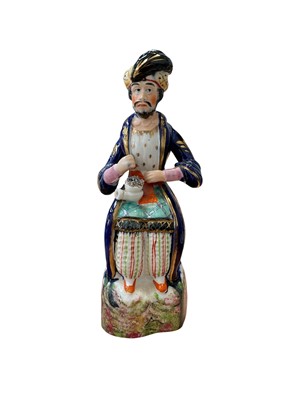 Lot 5090 - Unusual Staffordshire porcelain figure of a man in Turkish costume, circa 1840-50