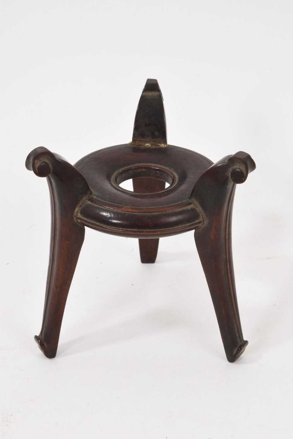 Lot 767 - Chinese hardwood three legged bowl stand