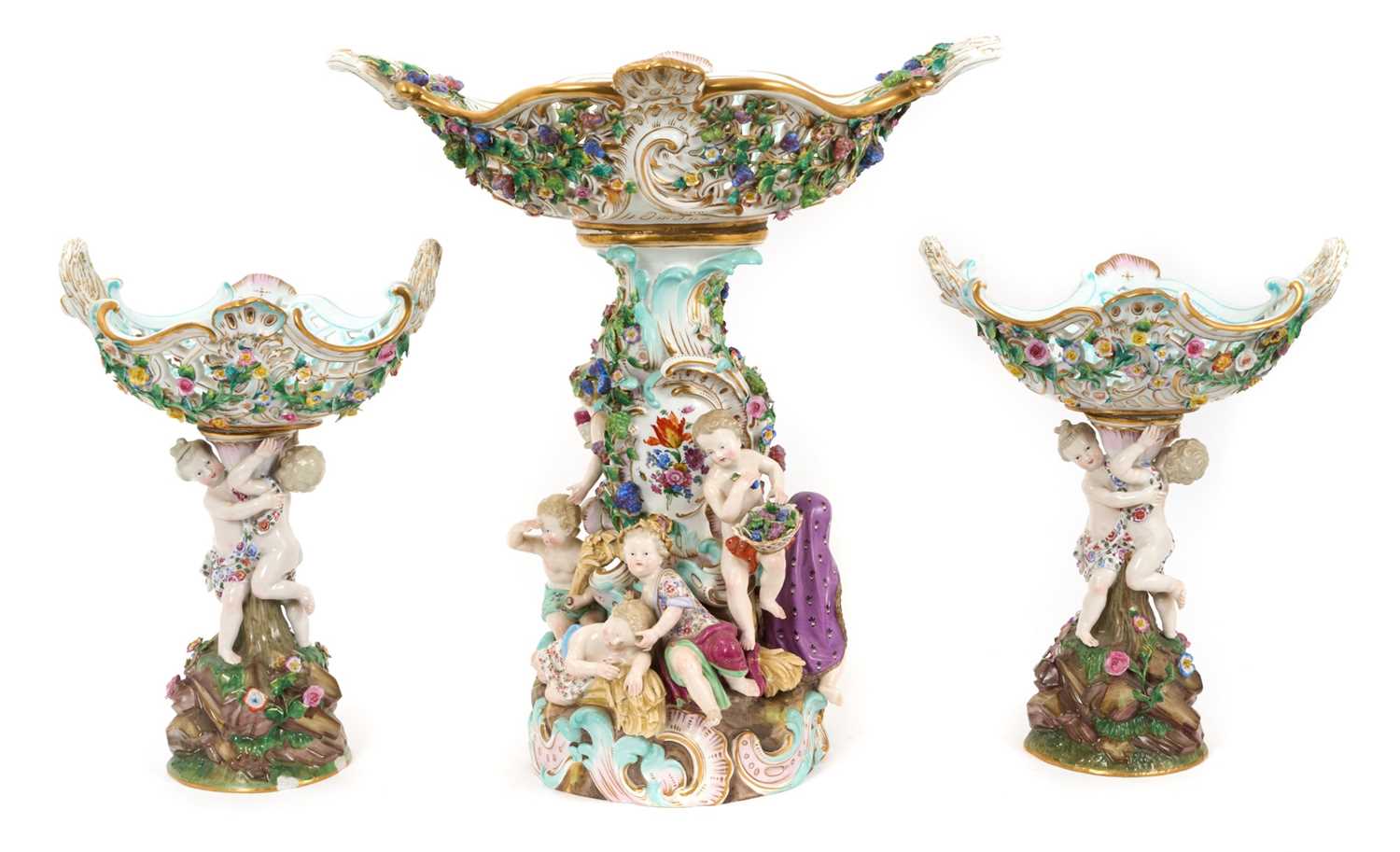 Lot 1 - Trio of late 19th century Meissen table centres, each mounted with cherubic figures