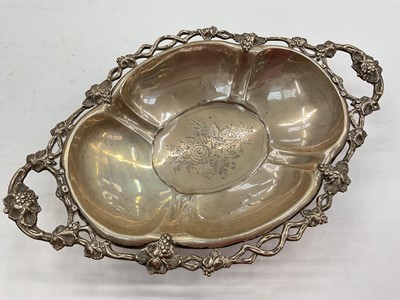 Lot 1158 - 19th century Continental white metal oval dish with engraved floral decoration and grape vine border and handles