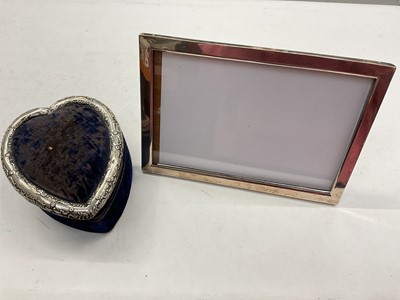 Lot 1174 - Late Victorian silver mounted heart shaped sewing box and a silver rectangular photograph frame (2)