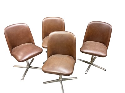 Lot 1463 - Set of four chrome based revolving chairs