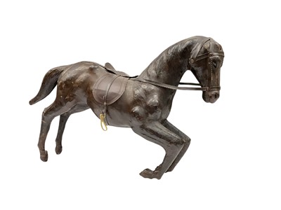 Lot 106 - Libery style leather model of a horse, 56cm long