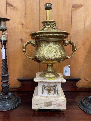 Lot 108 - 19th century gilt metal urn, of classical form, decorated in relief with a bull and lion, on marble base, converted to a lamp, total height 43cm