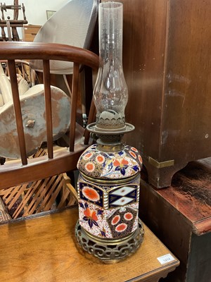 Lot 111 - Late 19th century Aesthetic style two-part oil lamp, the ceramic body in the Imari style, on brass base, with burner and chimney, total height 57cm