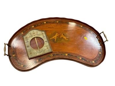 Lot 114 - Edwardian kidney shaped satinwood tray painted with cherubs and floral garlands, together with an antique brass frame with sequin decoration