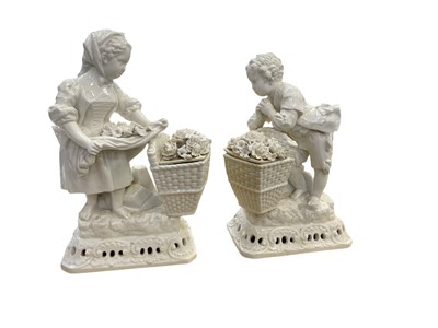 Lot 653 - Pair of 19th century continetal porcelain figures of children with baskets of flowers, the tallest 23.5cm in height.