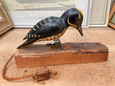 Lot 669 - Canadian novelty painted wood woodpecker ornament with moving action.