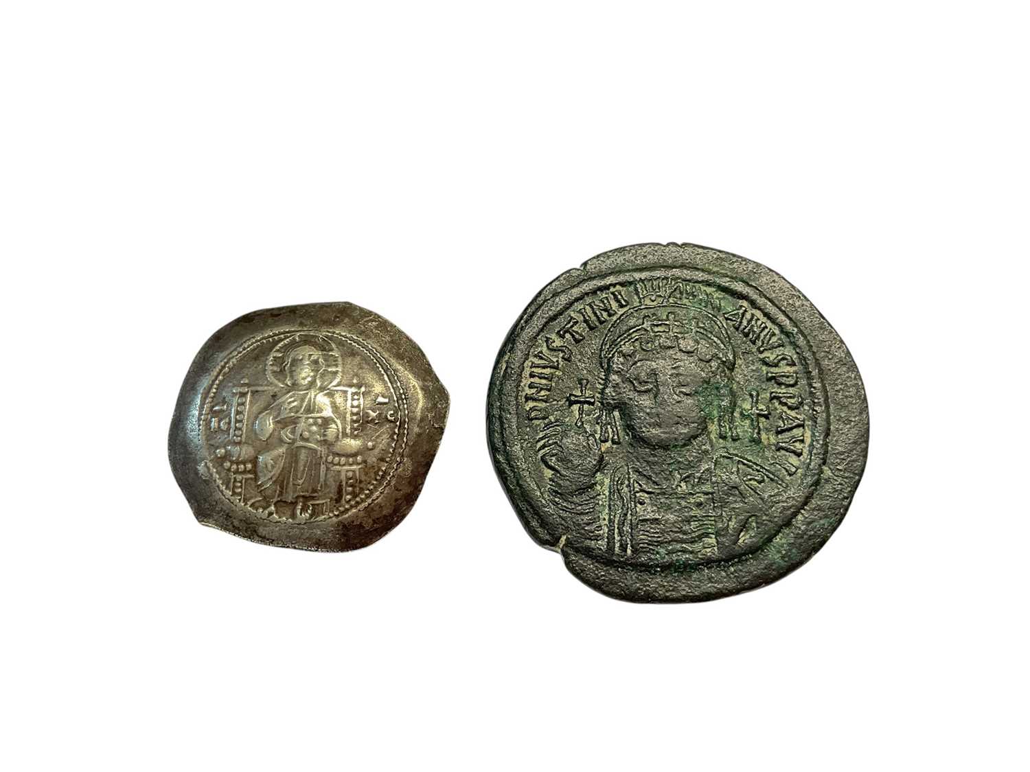 Lot 412 - Ancients - Byzantine coins to include Alexius I 1081-92 AD pre reform coinage silver Stamenon Nomisma (Scyphate) Obv: Christ enthroned in field to left IC; to right XC, Rev: Bust facing, wearing...
