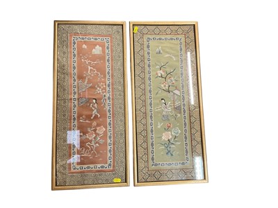 Lot 711 - Pair of Japanese silk panels depicting figures, in glazed frames.