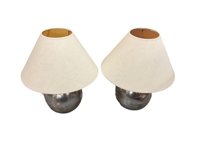 Lot 822 - Pair of round stainless steel lamps together with another stainless steel lamp and one other.