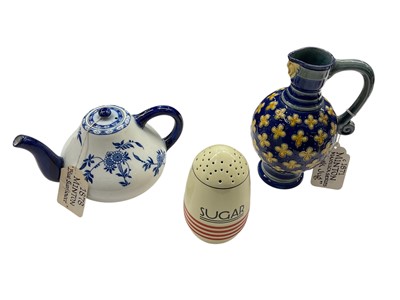 Lot 725 - Victorian Minton majolica mask jug, together with a Blue Sunflower pattern teapot and an Art Deco sugar pot (3)