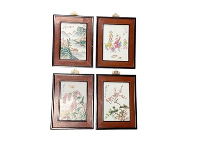 Lot 735 - Group of four contemporary Chinese porcelain plaques in wooden frames, each plaque measuring approximately 23.5 x 16.5cm