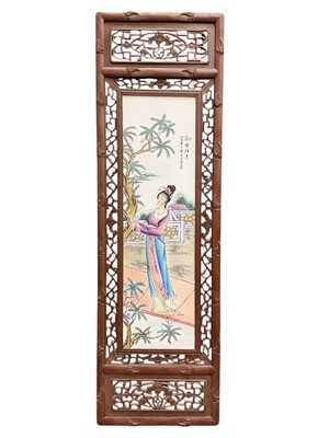 Lot 737 - Contemporary Chinese porcelain panel with figure decoration in a carved wood frame, 120.5cm x 36.5cm overall