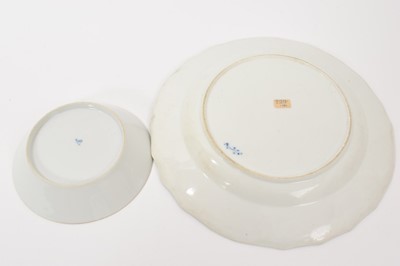 Lot 118 - Group of continental porcelain, including a Tournai plate, circa 1780, with moulded edge, painted in underglaze blue with flowers in the oriental style, together with a German cup and saucer pai...