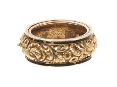 Lot George IV gold and enamel mourning ring, the wide gold band with a foliate design flanked by black enamel borders, inscribed "Clementine Elphinstone, died 6 of Augt. 1821", ring size approximate...