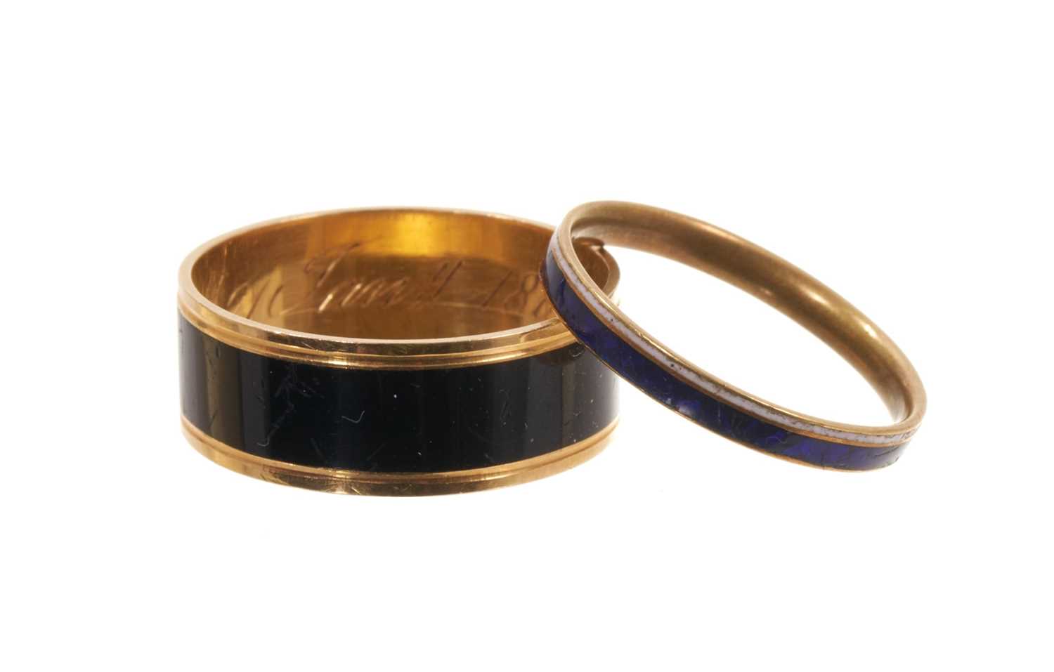 Lot Two George III mourning rings, one with a plain black enamel band and inscribed "Hu: Robertson, obt. 21 Jany. 1800" ring size approximately N½-O, together with a George III blue and white enamel...