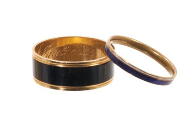 Lot Two George III mourning rings, one with a plain black enamel band and inscribed "Hu: Robertson, obt. 21 Jany. 1800" ring size approximately N½-O, together with a George III blue and white enamel...