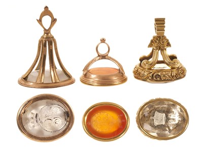 Lot Three good quality early 19th century seals, one with an intaglio carved citrine with ducal coronet and initials, one other with intaglio coronet and one with family crest and motto (3)