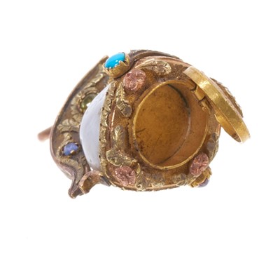 Lot A fine quality Regency gold mounted and gem-set pearl charm in the form of a Roman officer's helmet, the blister pearl with three-colour gold mount, set with multi-gems, ar...