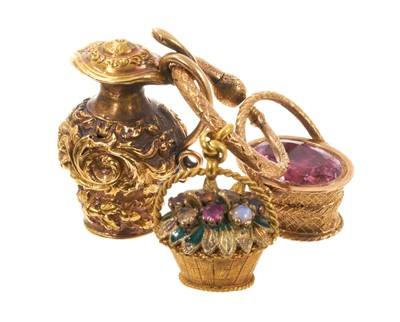 Lot 530 - Three Regency novelty charms/seals, to include a yellow metal multi-gem and enamel basket, another yellow metal basket with foil-backed pink stone and intaglio seal with Cupid, and a yellow meta...