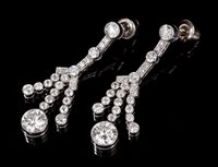 Lot 601 - Pair Art Deco-style diamond pendant earrings,...