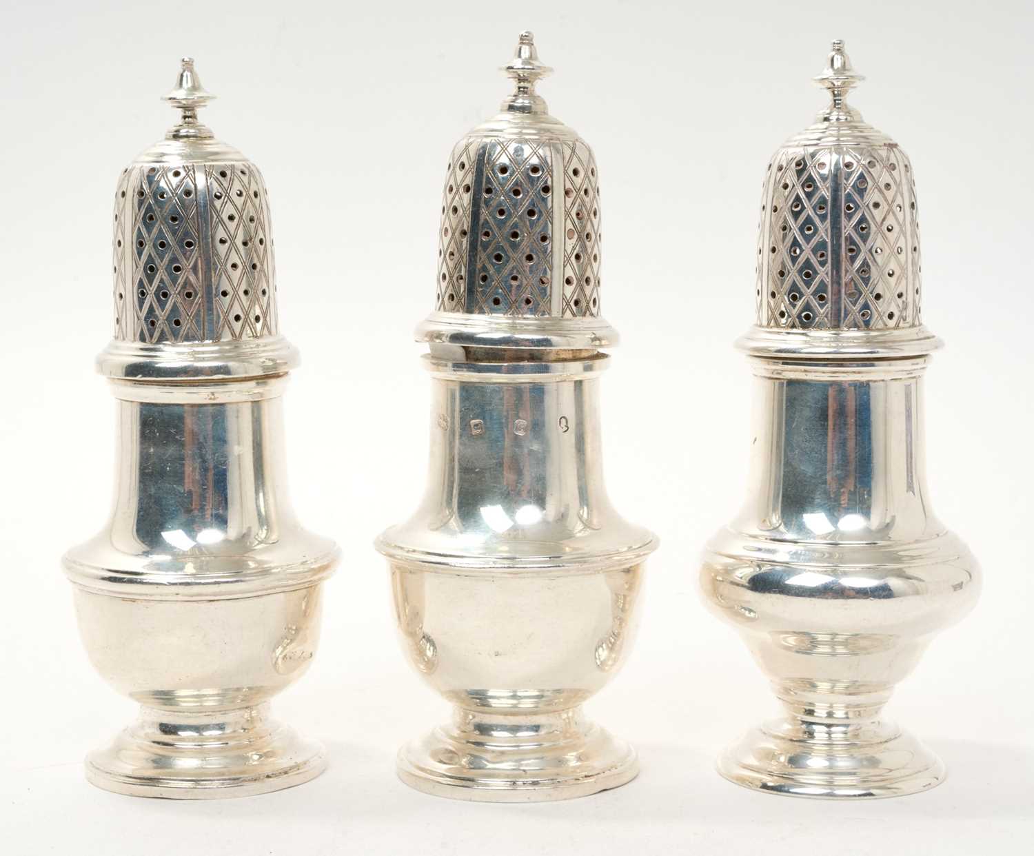 Lot 456 - Three contemporary silver casters of similar
