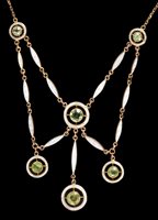 Lot 620 - Edwardian peridot and white enamel necklace...