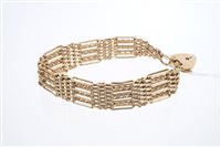 Lot 628 - Gold (9ct) gate bracelet with seven bar links...