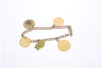 Lot 629 - Edwardian yellow metal charm bracelet with...