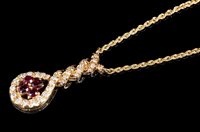 Lot 630 - Ruby and diamond gold (18ct) pendant necklace...