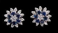 Lot 632 - Pair sapphire and diamond flower-head cluster...