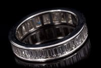 Lot 649 - Diamond full band eternity ring, with a...