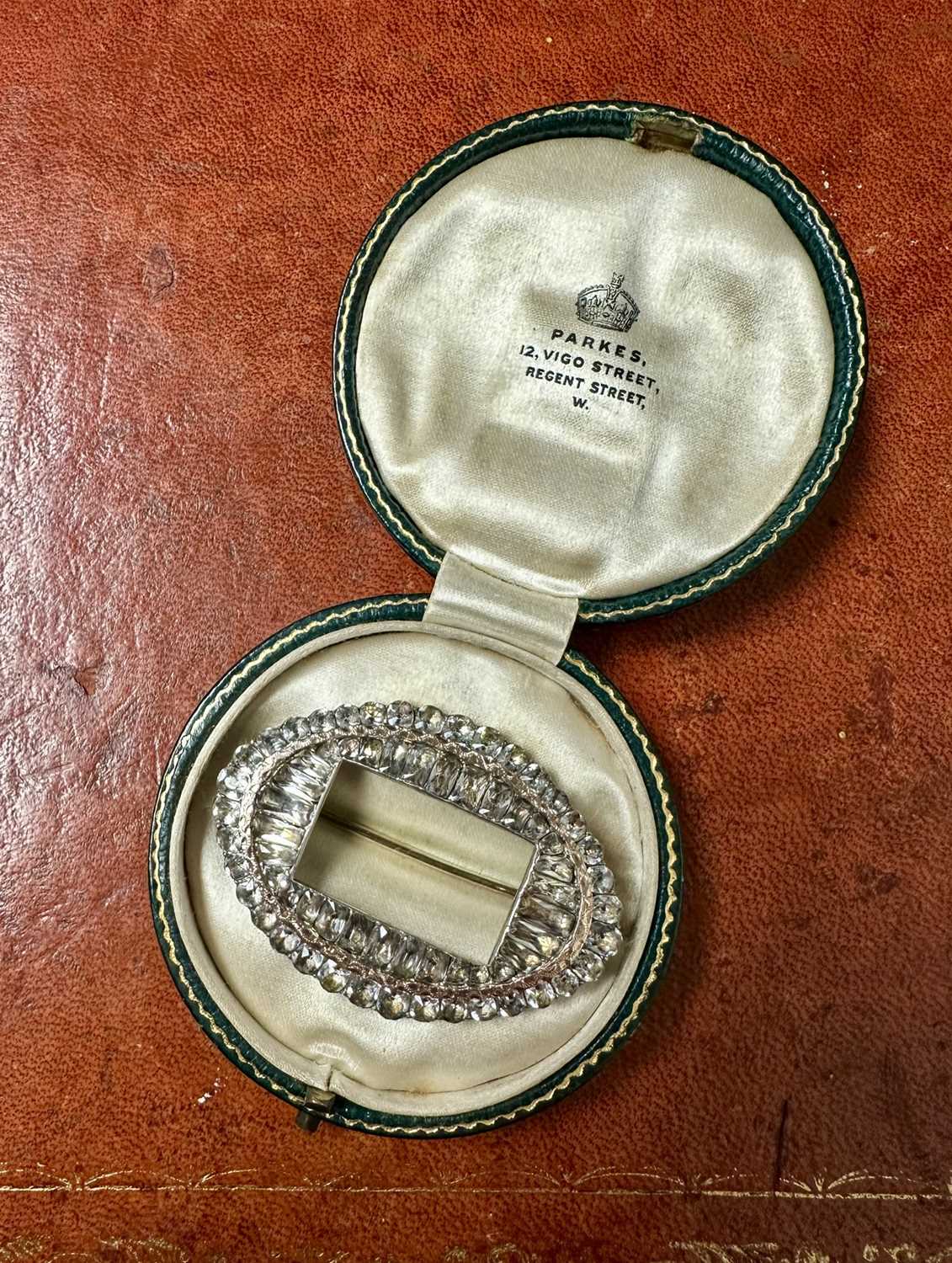 Lot 158 - Georgian paste set buckle in yellow and white metal setting, converted to a brooch, in antique Parkes box