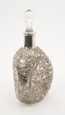 Lot 284 - Chinese silver mounted Dimple Haig whisky bottle with pierced bamboo and prunus decoration