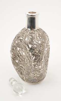 Lot 284 - Chinese silver mounted Dimple Haig whisky bottle with pierced bamboo and prunus decoration