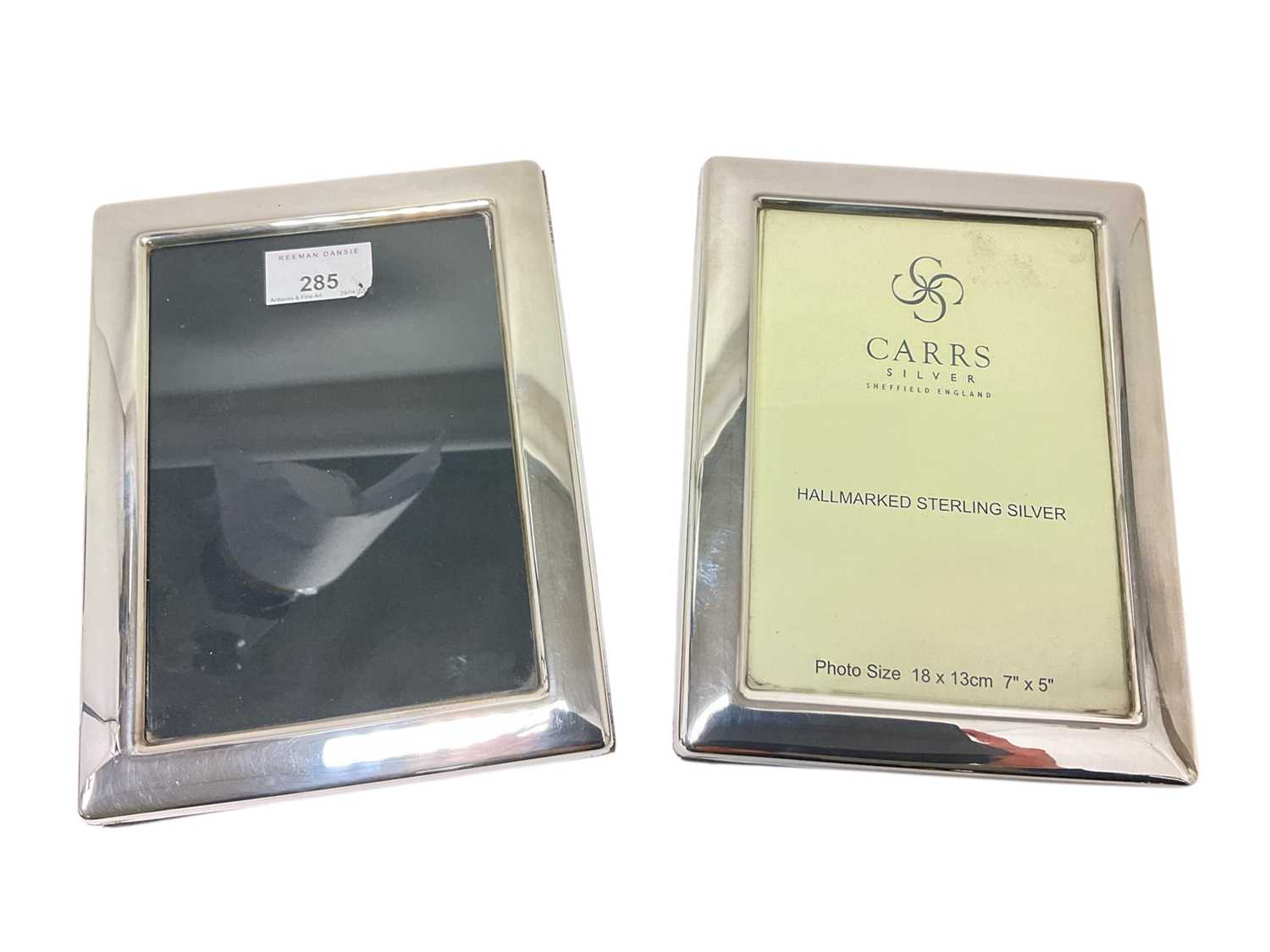 Lot 285 - Pair of contemporary silver photograph frames of rectangular form with easel back supports