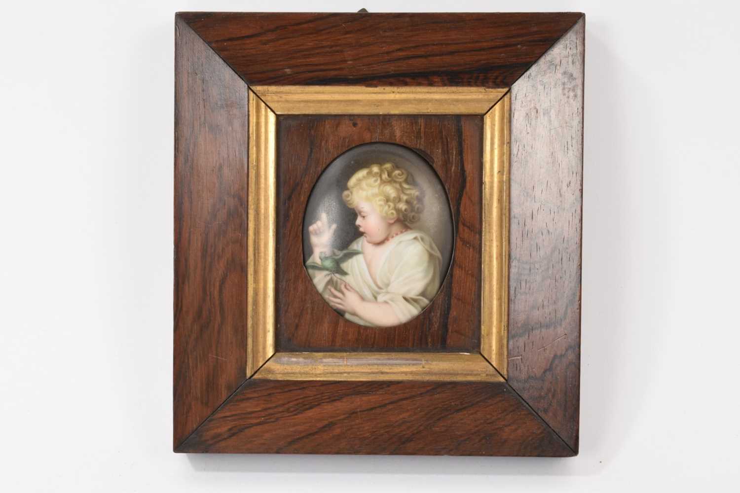 Lot 44 - 19th century KPM style hand painted porcelain plaque of a child with a parrot, framed