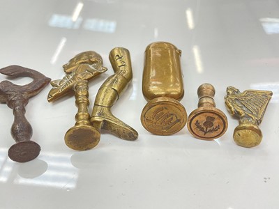Lot 386 - Collection of brass pipe tampers and desk seals including 18th century and later examples and a combination desk seal vesta